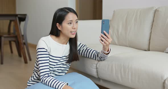 Woman Look at Mobile Phone at Home