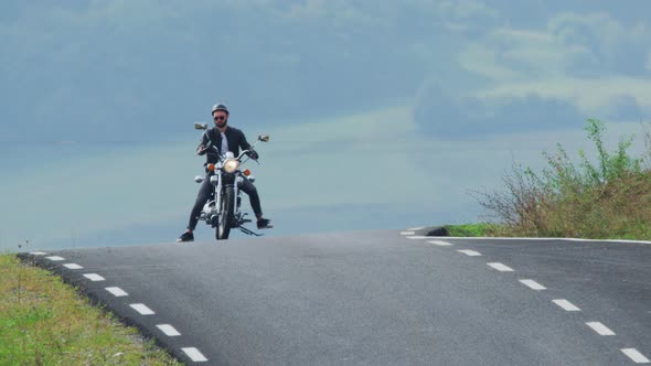 Man starting his motorcycle ride