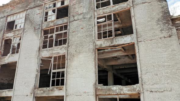 Old industrial building for demolition. Abandoned building exterior. Aerial view.