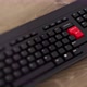 Game On red button on keyboard. A finger presses Enter. Click Game On. Realistic button, wideshot - VideoHive Item for Sale