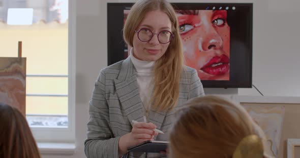 Portrait of Girl in Eyeglasses Looking at Camera with Smile