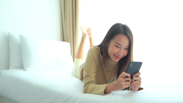 Young asian woman use smart phone