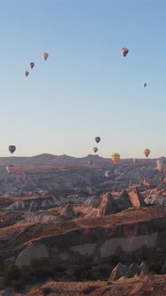 Vertical Video of Hot Air Balloons Flying in the Sky Over Cappadocia Turkey