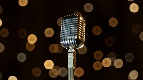 The shiny vintage microphone. Old classic mic. Rock star. Retro music sound.