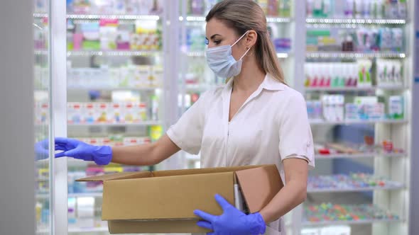 Tired Caucasian Female Pharmacist Putting Bottles with Pills on Shelf in Drugstore Taking Off