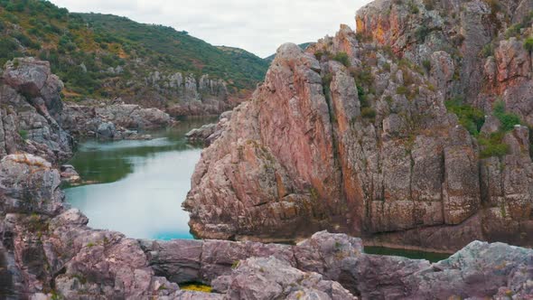 Aerial View of the Mountain River Near Mertola