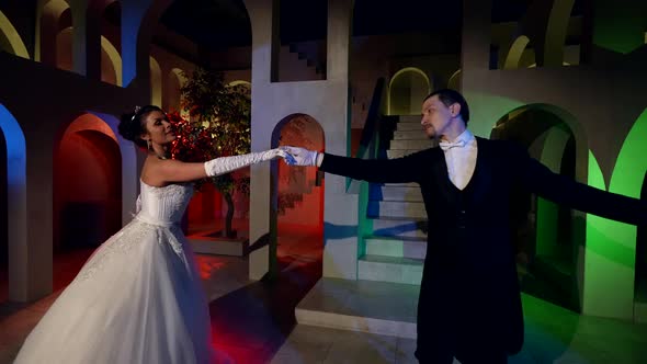 Lady with Brilliant Jewellery is Dancing with Elegant Man in Fabulous Ballroom Fairytale Ball