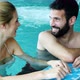 Picture of Happy Couple Relaxing in Pool - VideoHive Item for Sale