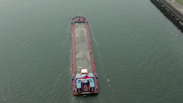 Aerial View of a Bulk Carrier Ship Moving Silt and Sand