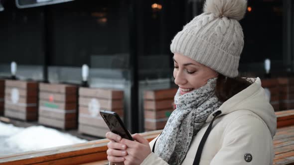 Happy Girl Chatting with Her Friends on the Phone