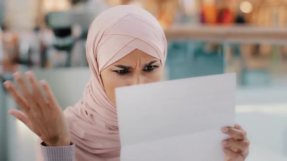 Closeup Young Muslim Woman Sitting Reading Paper Letter Bad News Frustrated Islamic Girl Shocked By