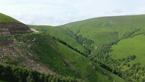 View of the Green Caucasus Mountains in Summer From the Sky