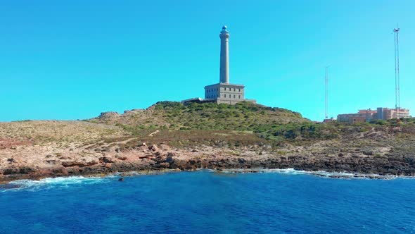 Aerial View of a Lighthouse Named Faro Cabo De Palos Located on the Top of a Cliff