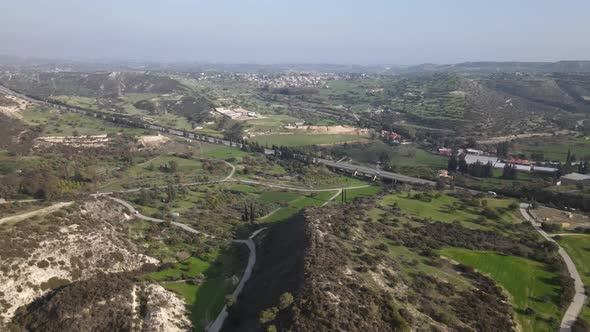 Types of Cyprus in the mountains. Top view of the mountains and human structures.