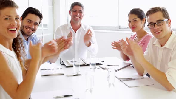 Team of Business People Clapping at the Camera