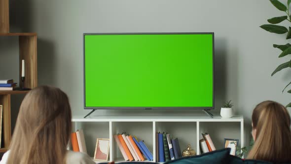 Women Watching Television with Chroma Green Screen