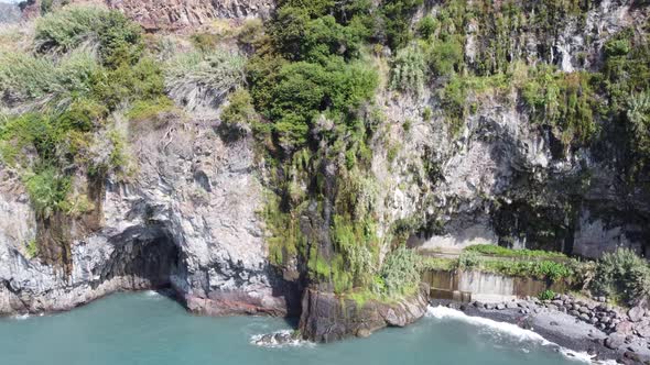 Amazing aerial drone view of the ocean and cliffs. Beautiful blue ocean water