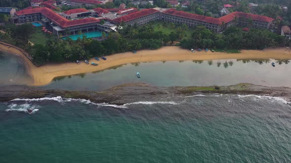 Aerial view of hotels and resorts along Bentota beach, Sri Lanka.
