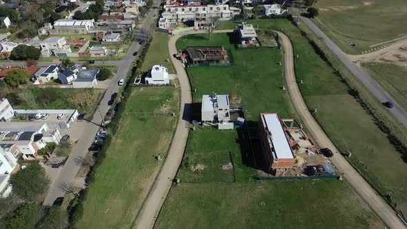 Neighborhood under construction, aerial view with drone of the houses, fields and avenues.