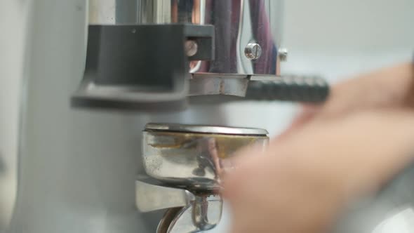 Barista Makes Coffee on a Coffee Machine