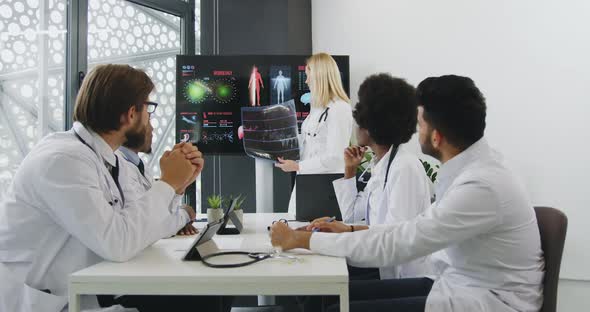  Female Doctor Holding Presentation on Digital whiteboard on theme of Internal Human Organs