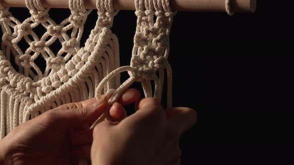 Woman Weaves Pattern of Macrame Threads with Her Own Hands for Decoration or Home Decor