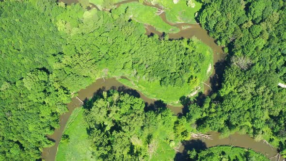 Aerial view of a river flowing through a beautiful landscape 