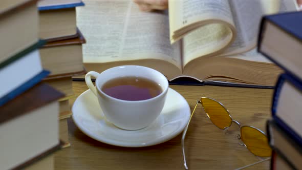 Male Hand Flipping Through the Pages of a Book Closeup