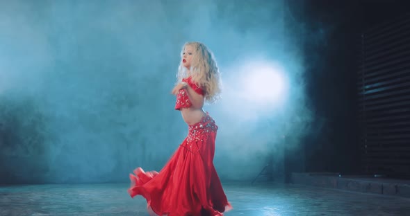 Young Blonde Dances Oriental Dance in a Beautiful Suit with Stones