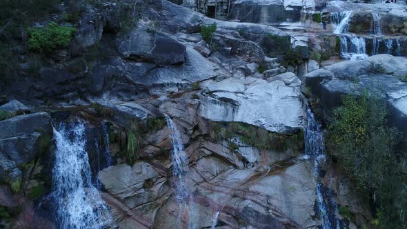 Waterfall Surrounded By Rocks