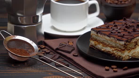 Portion of Traditional Italian Tiramisu Dessert Cup of Espresso and Coffee Beans