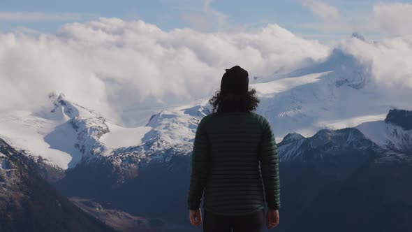 Adventurous Caucasian Woman Hiking on Top of a Canadian Mountain