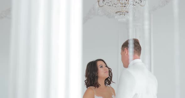 Bride and Groom Kissing Wedding Couple Indoors Looking at Each Other Beautiful Girl Model in White