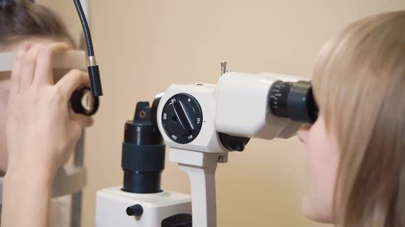 the Doctor Is Engaged in Biomicroscopy of the Eye To Check the Eyes of the Child