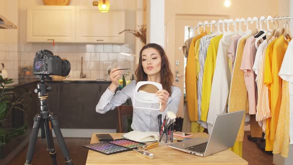 An Attractive Blogger Girl Records a Video at Home. She Runs a Blog on Her Personal Channel, Remote