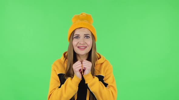 Portrait of Modern Girl Is Looking at Camera with Excitement, Then Celebrating Victory