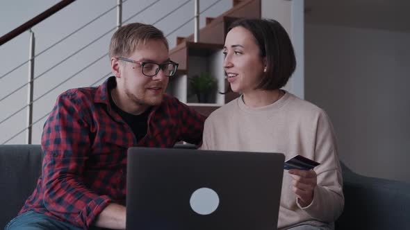 Woman an Adult Man Making Online Shopping, Using Laptop Computer