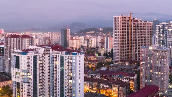 City Space with Skyscrapers and Windows Changings Light. Day To Night Timelapse in Batumi