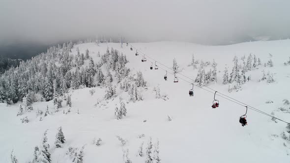 Fly over people on a ski lift