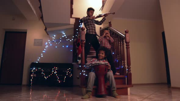 Three Kids Playing Christmas Music.