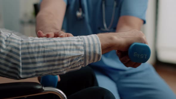 Close Up of Hand of Patient Holding Dumbbells