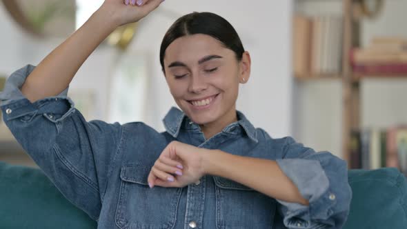 Latin Woman Listening Music, Dancing on Sofa