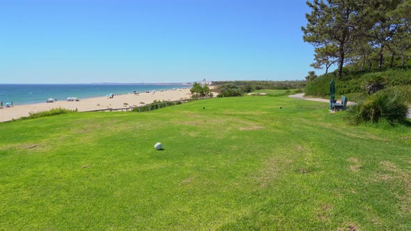 Grassy Field Near a Pleasant Looking Beach and Glistering Ocean Water in Vale Do Lobo Portugal