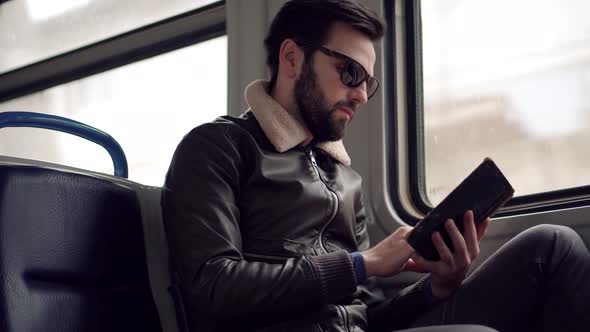 Peaceful Businessman Take Break Relax After Hard Work In Office Enjoy Reading Book On Tram.