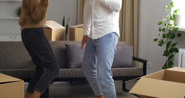 Young Friends Family Couple Woman with Curly Afro Hair and Caucasian Man in Jeans and White Shirt