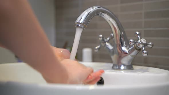 Girl Washes Her Hands