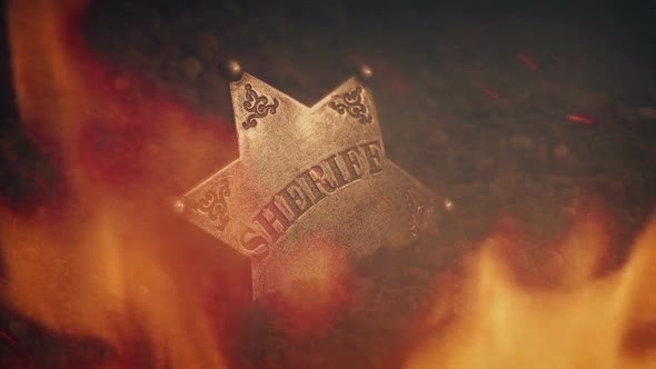 Sheriff Badge On Ground In Flames