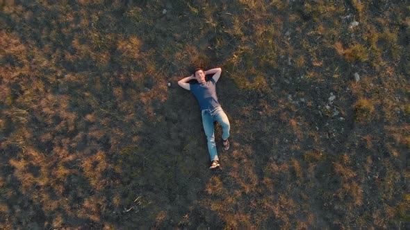 Aerial Shot Young Man Lying Down and Resting