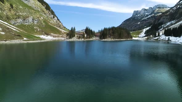 Aerial Flight Over Seealpsee Lake In The Mountains Of Switzerland