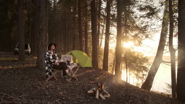 A young girl on a picnic with a tent